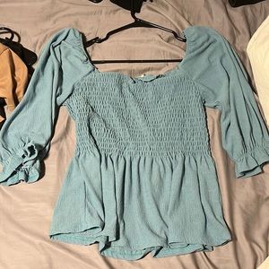 Women’s teal/blue shirt